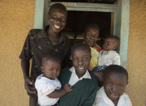 I-KODI board member and Women's Group Representative, Rosalind Owino with her family in Pap Onditi.