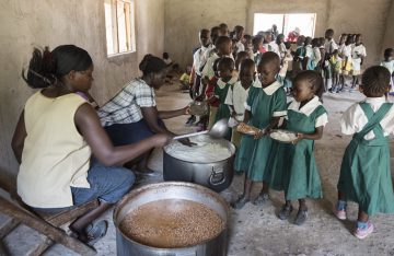 Children at the Konditi Primary School receive a hot meal at lunchtime.