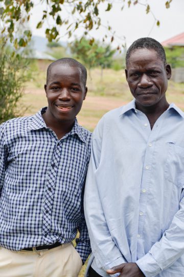 Our first scholarship student Calvin with his father. Calvin is now attending university!